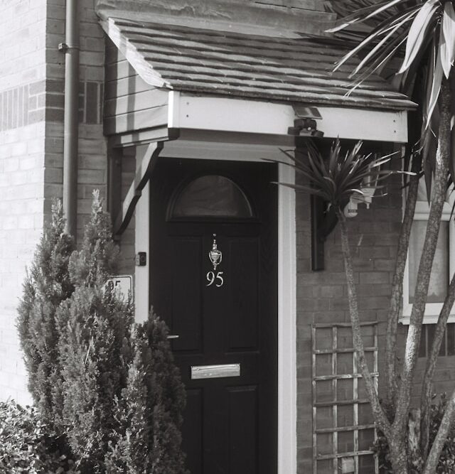 Black and white image of a door canopy