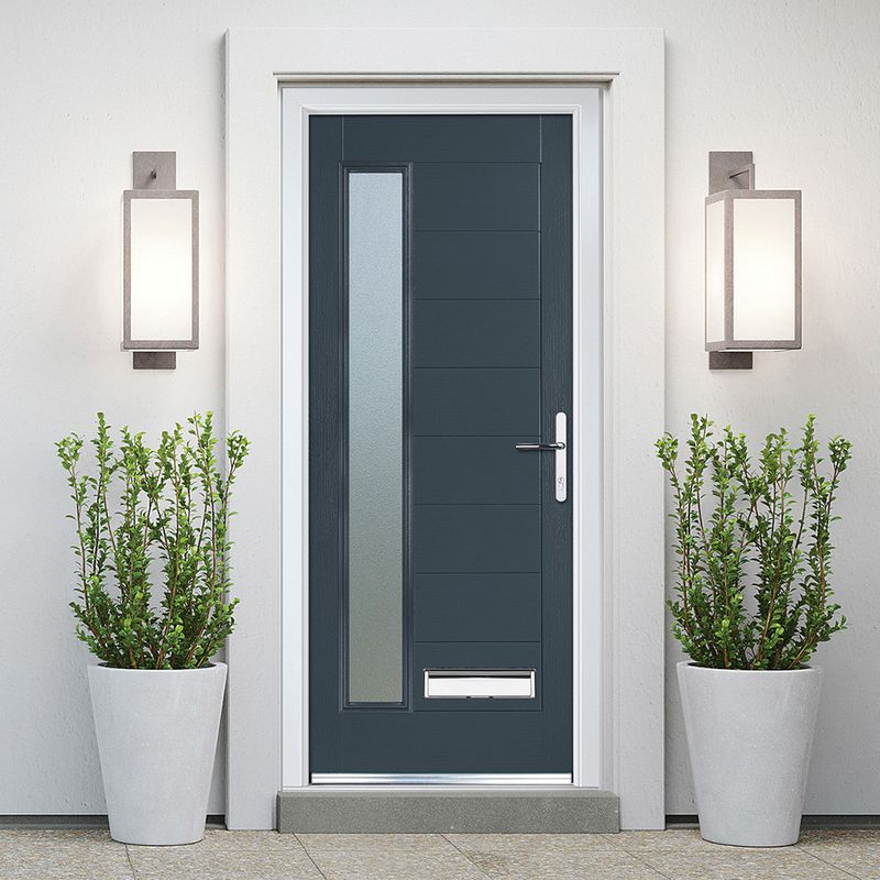 Grey front door with planters on each side.
